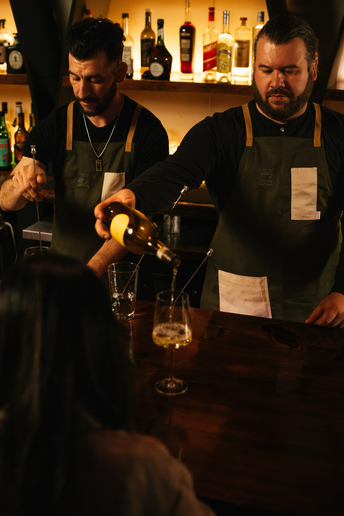 bartenders behind the bar